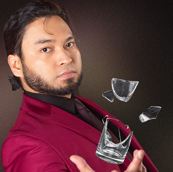 Magician and mentalist Apollo Riego, delivering close-up illusions and captivating stage magic performances for events.