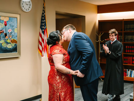 A first kiss during a courthouse wedding ceremony at Franklin County Municipal Courthouse in downtown Columbus, Ohio