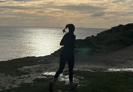 A woman running at the coast