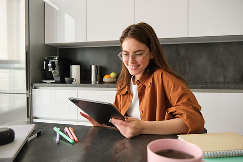 portrait-young-student-woman-studying-home-working-remotely-setup-workplace-her-kitchen.jp
