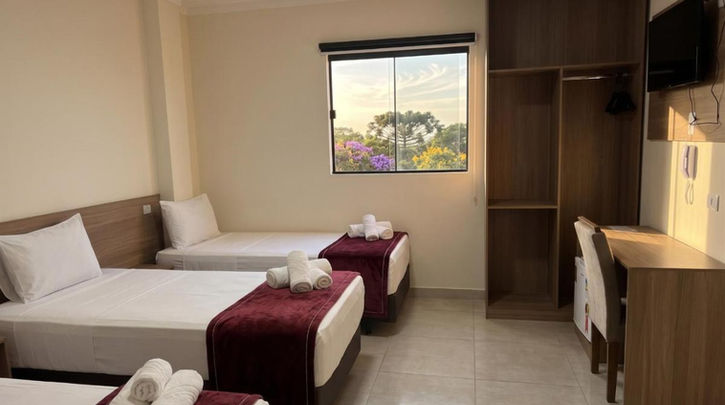 acomodacoes quarto triplo com vista para o jardim no Hotel Internacional Guarulhos