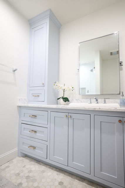 Bathroom renovation with custom vanity and marble flooring by One 13 Design, Dallas