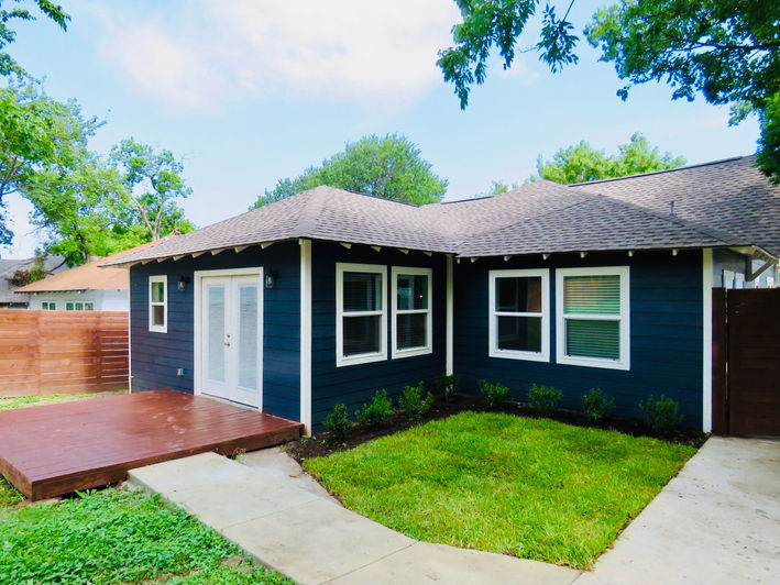 Backyard exterior renovation with new exit and improved indoor-outdoor connection by One 13 Design in Dallas