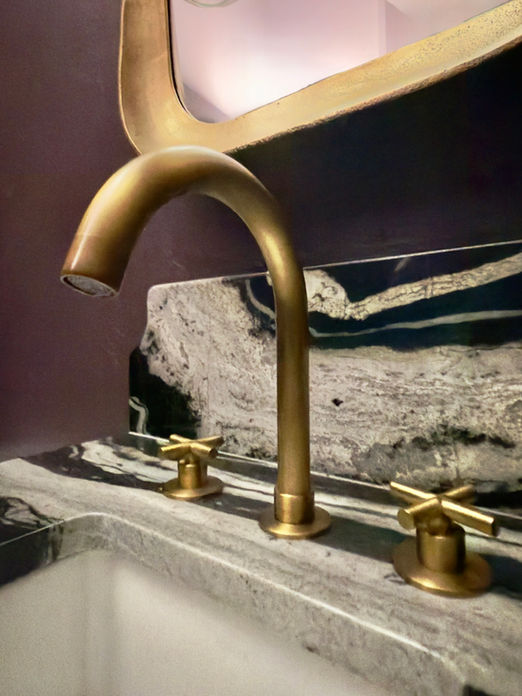 Brushed brass faucet and marble sink detail in Dallas home by One 13 Design