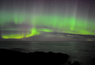 Northern Lights shining over Whale Rock where I brew beer