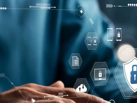 Hands typing on a keyboard with digital security icons overlay. Blue background, abstract symbols, conveying technology and protection.