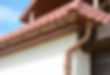 house-attic-metal-roof-with-soffits-fascias-roof-guttering-downspout-gutter-pipe.jpg