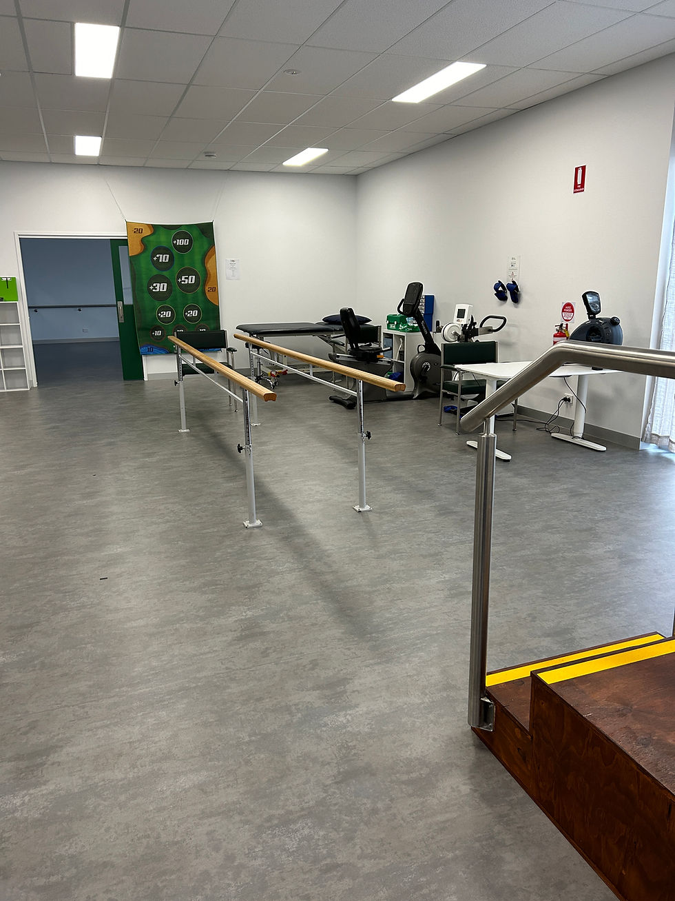 Another view of The Neuro Collective Therapy space showing walking rails