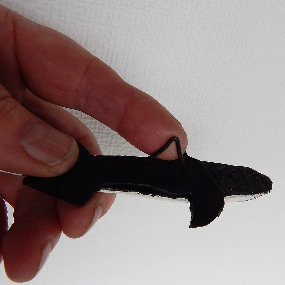 Thumbnail: Little Atlantic Mackerel handmade in leather with glass eyes, showing view of back with practical hanging hook in black,
