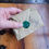 Thumbnail: Neat leather covered needle case with four white felt pages for pins, needles etc. Neatly packed in kraft paper with wax seal