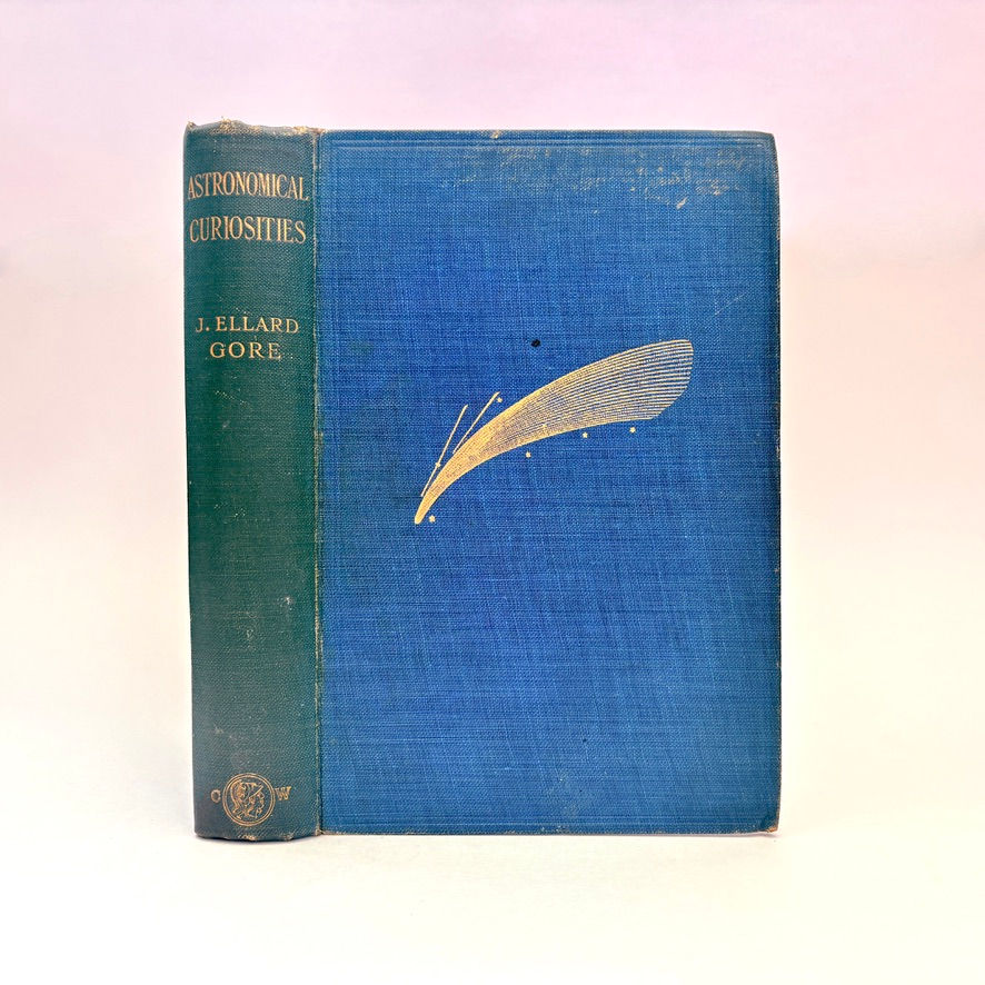 Front cover and spine showing gilt shooting star Astronomical Curiosities Gore 1909 first edition