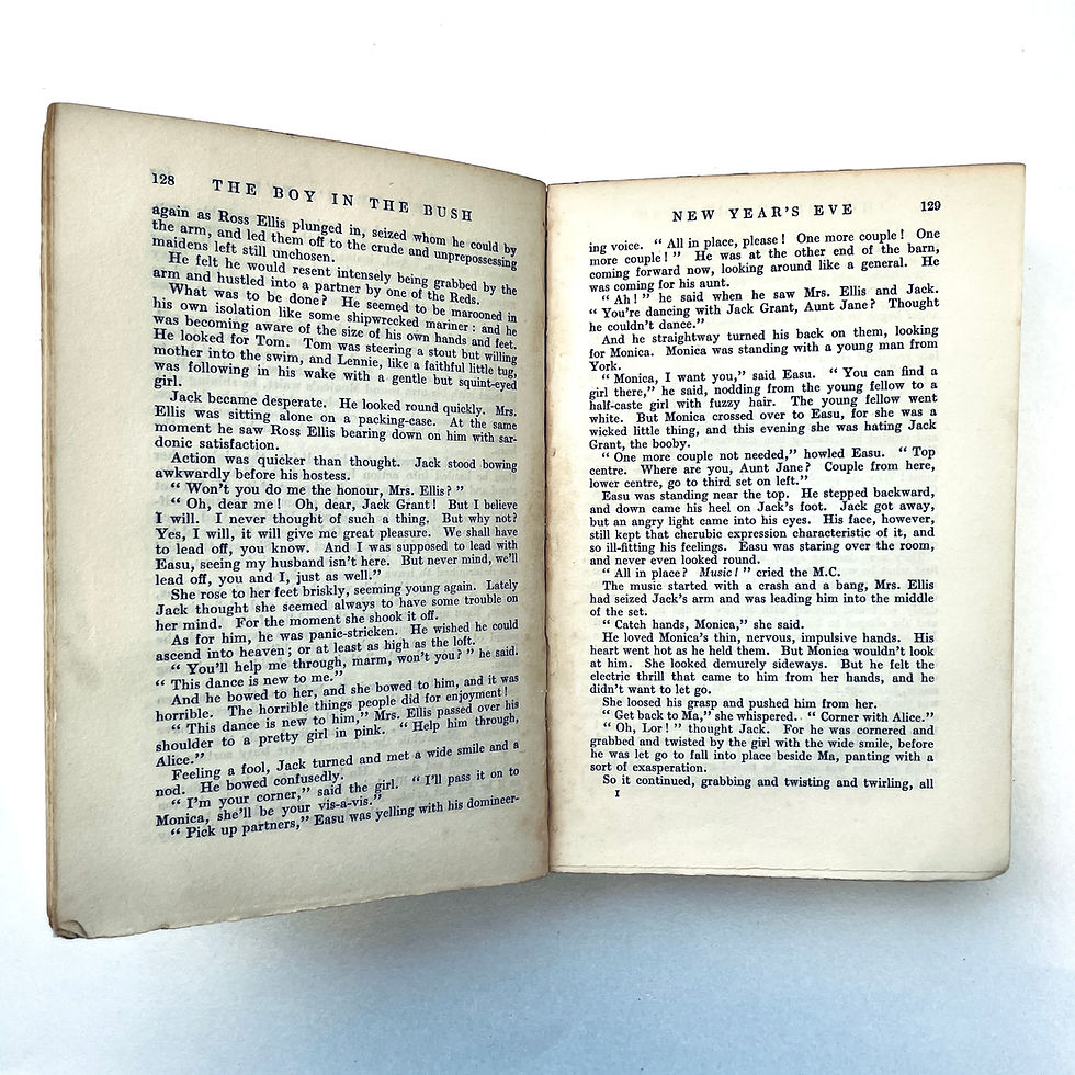 サムネイル： Pages 128–129 showing light foxing and rough-cut edge typical of book's age