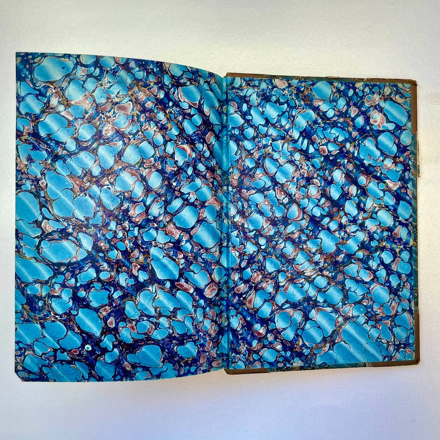Miniatura: Marbled back pastedown and free endpaper of Victorian half calf edition of The Pilgrim’s Progress.