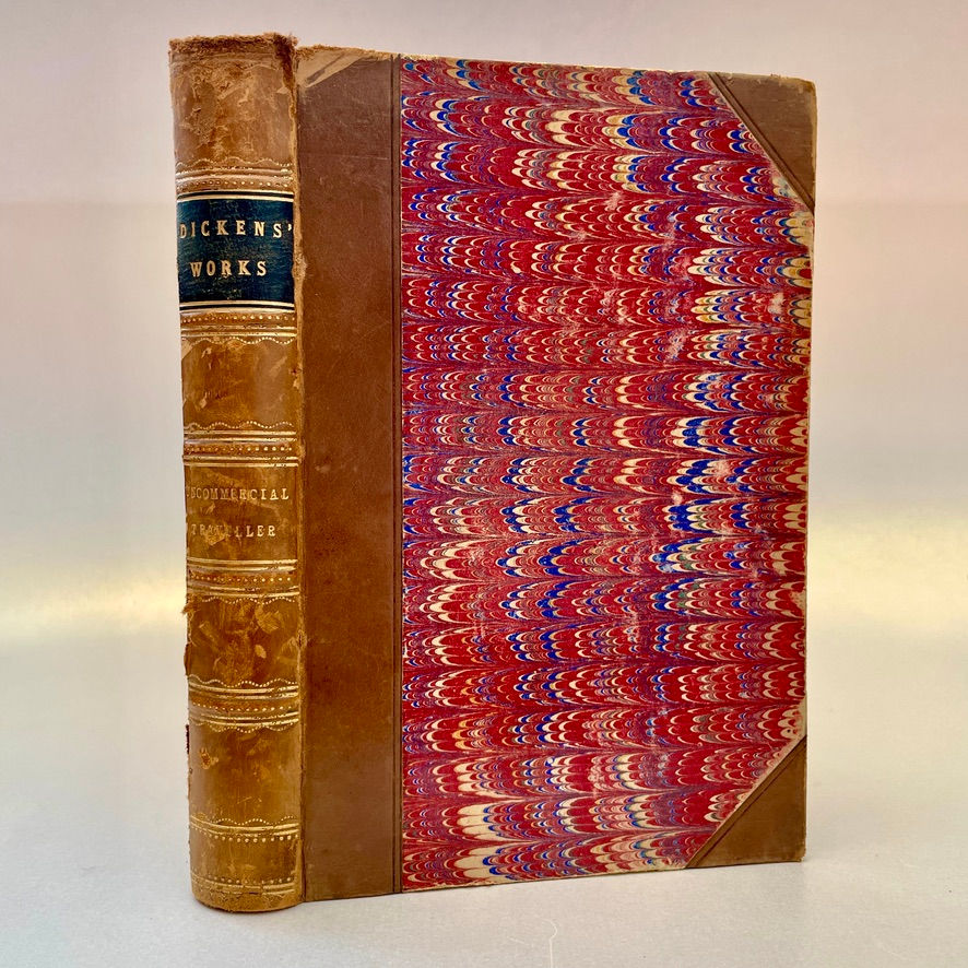 Spine and front board of the book – Showing gilt-decorated raised bands and marbled paper sides