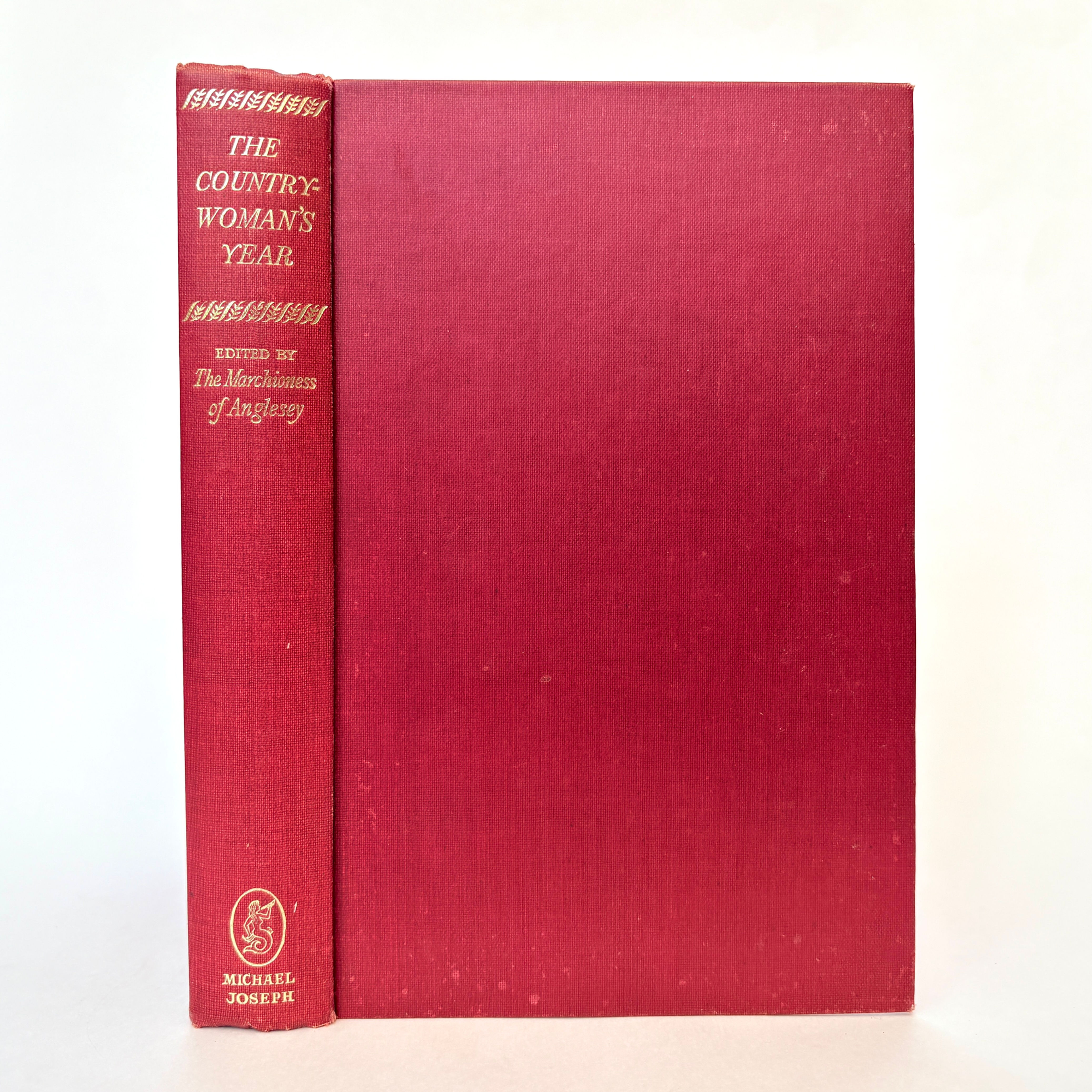 Front board and spine of The Countrywoman's Year 1960 first edition red cloth binding