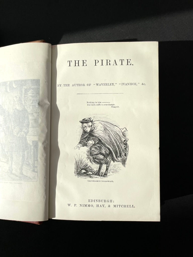 Pikkukuva: Illustrated title page for The Pirate by Walter Scott, ornate Victorian engraving and typography.
