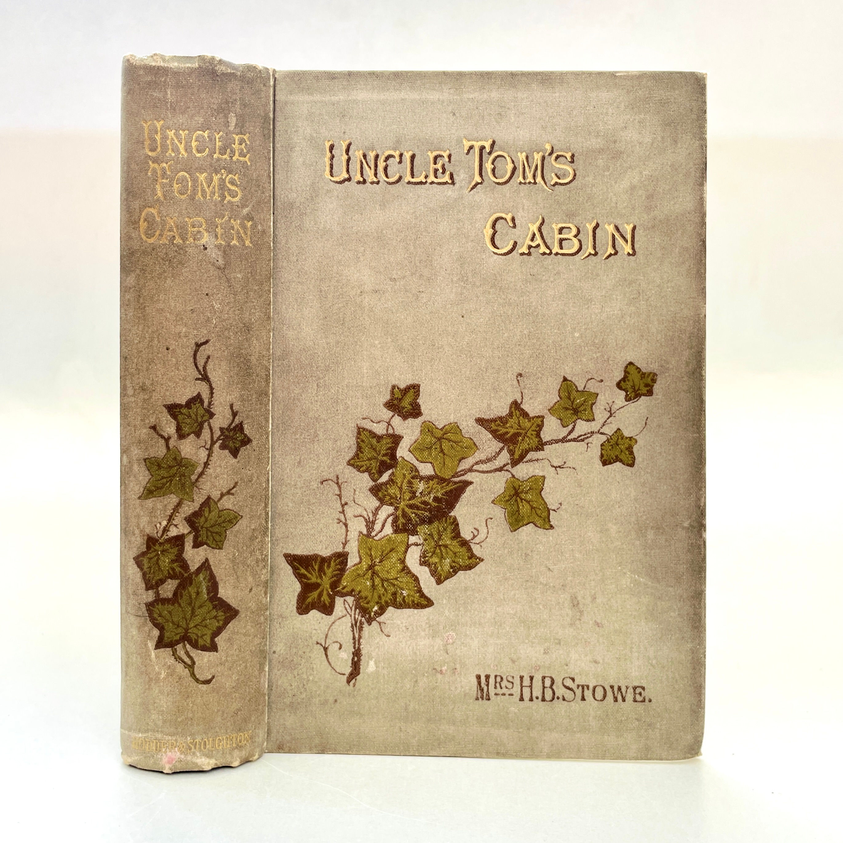Grey cloth binding with gilt lettering and ivy illustration, slight edge wear.