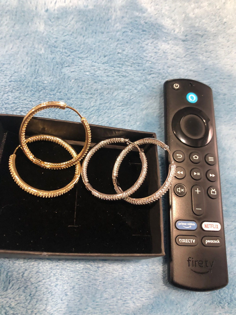 Thumbnail: Silver or gold diamond hoop earrings.