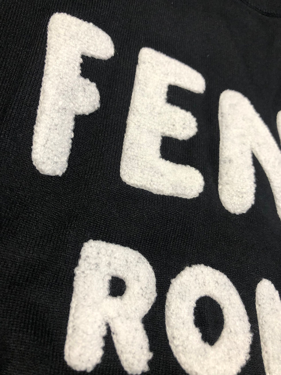 Thumbnail: Black Fendi sweater white lettering.