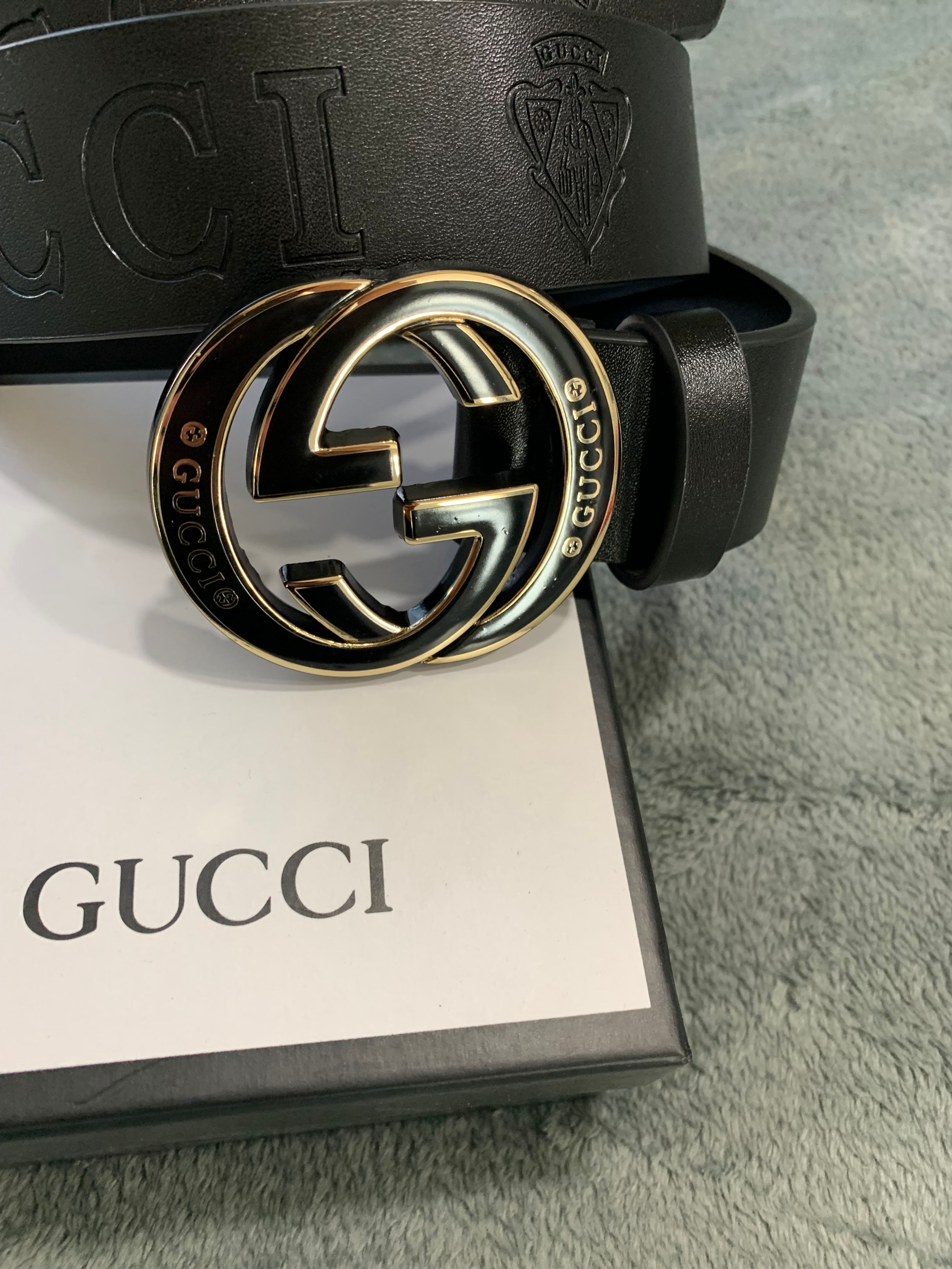 BLACK AND GOLD GUCCI BELT