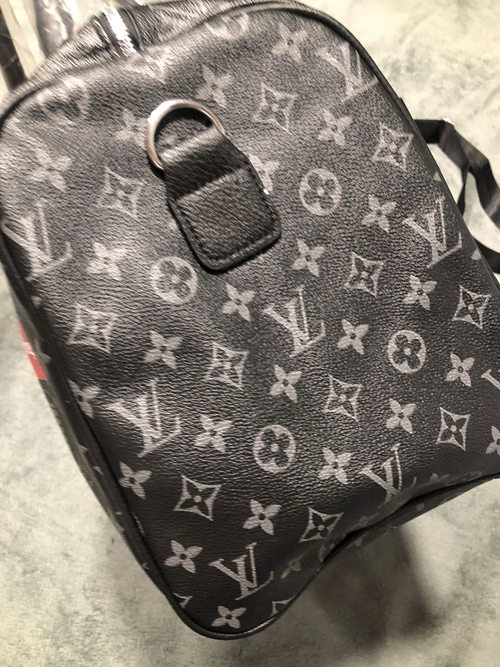 Thumbnail: black duffel bag