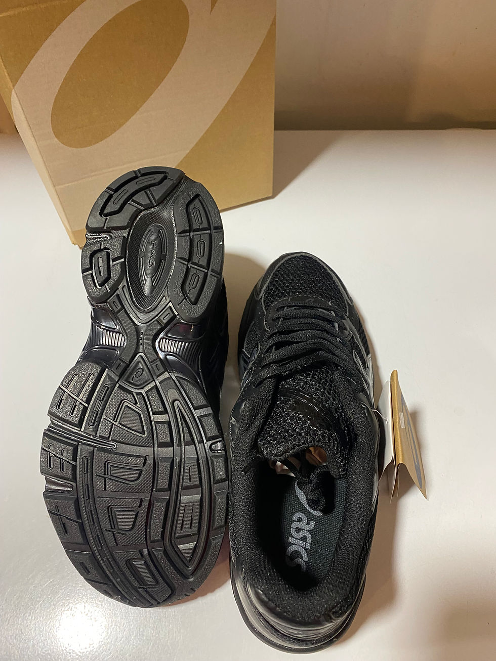 Thumbnail: triple black Asics.