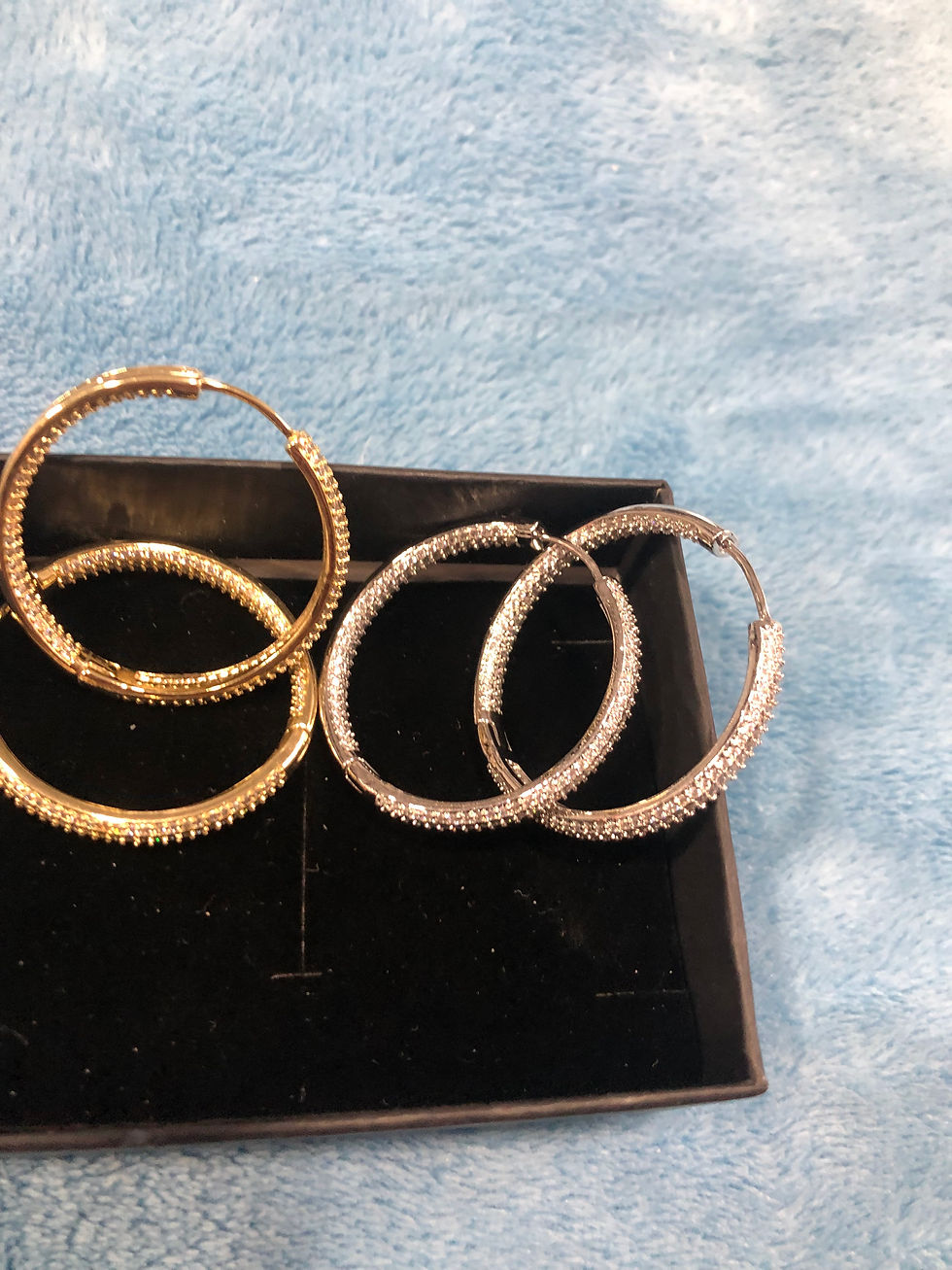 Thumbnail: Silver or gold diamond hoop earrings.