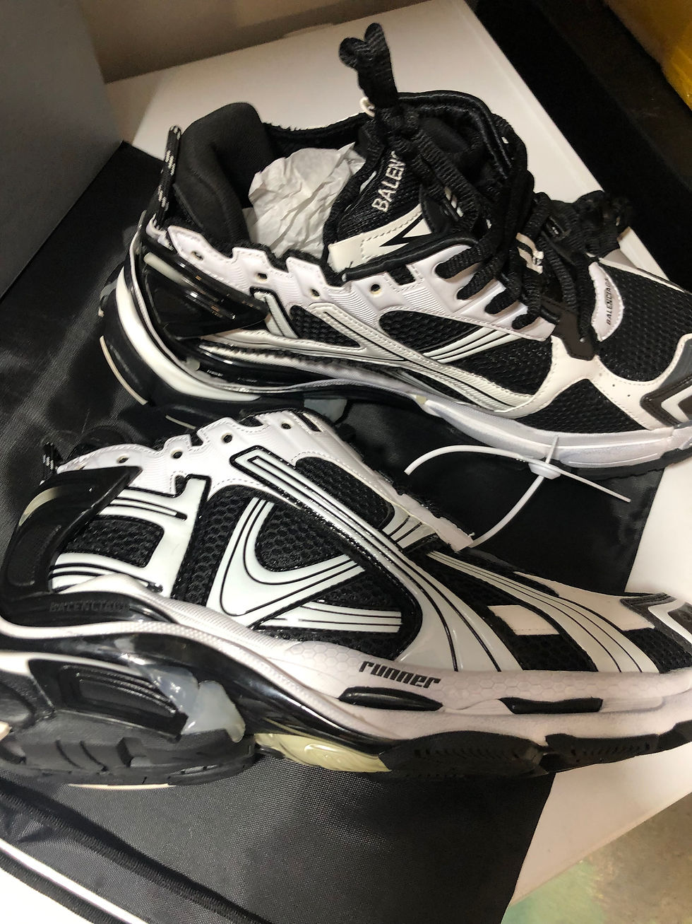 Thumbnail: Black and white Balenciaga runners.