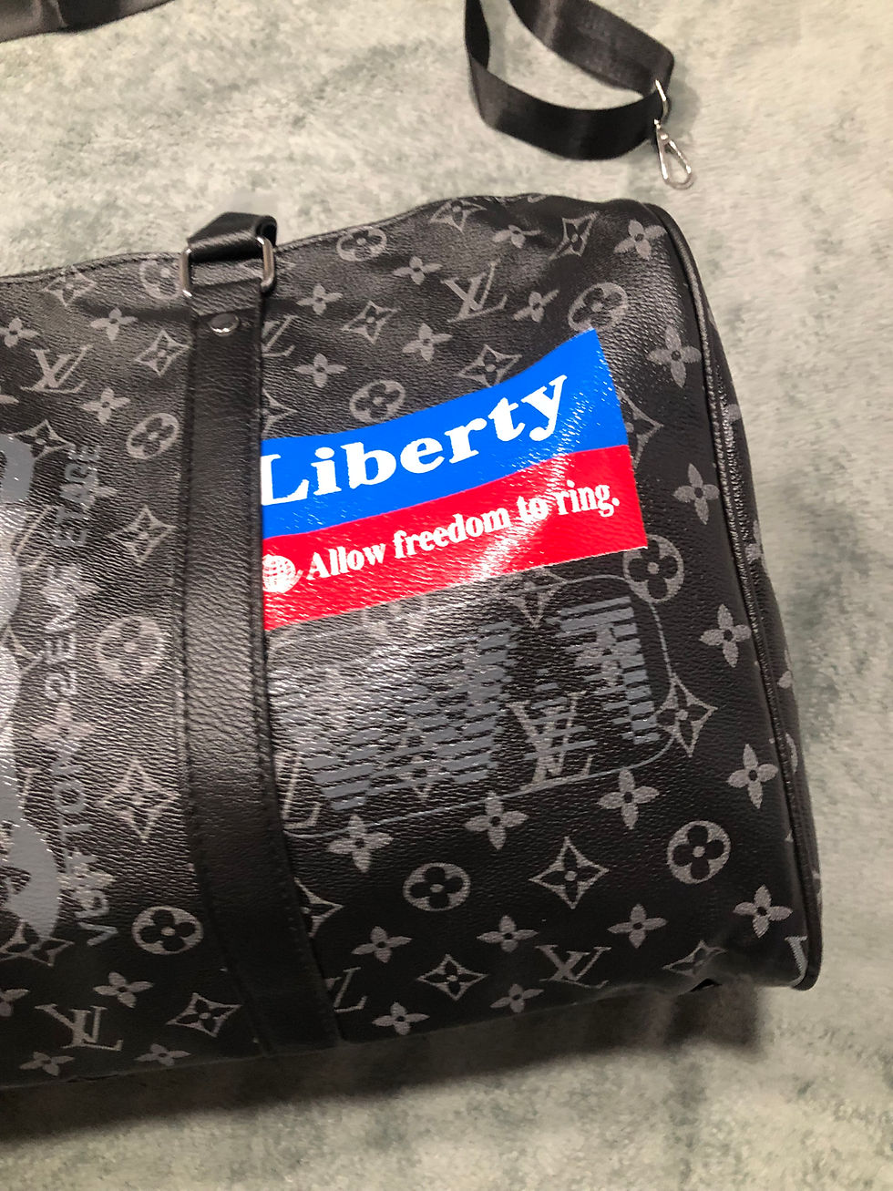 Thumbnail: black duffel bag