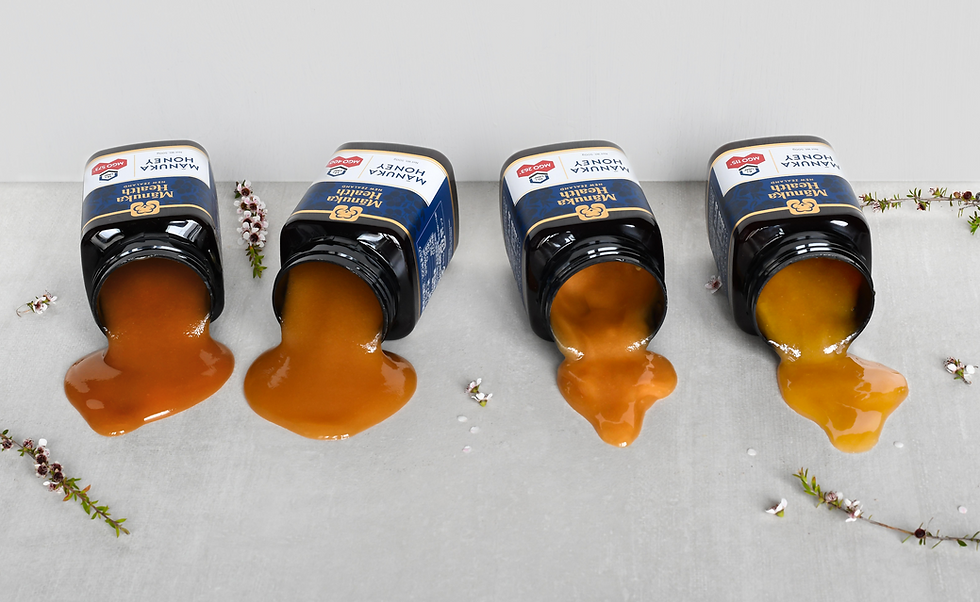 Manuka honey bottles laying down on the table