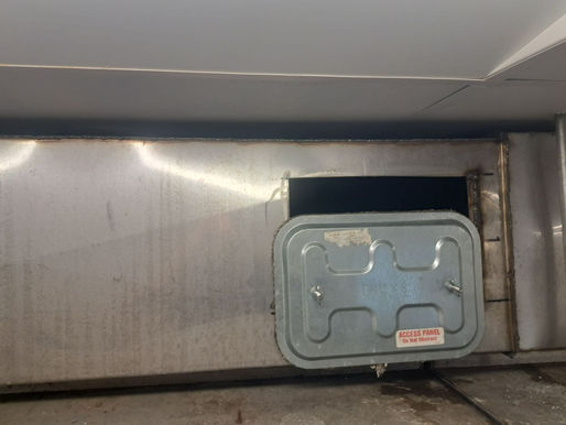 Code-compliant grease duct access door installed on a horizontal kitchen exhaust line