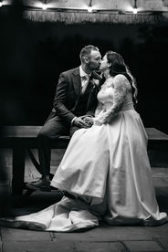 Bride and groom kissing under gazebo at High House Wedding, Maldon