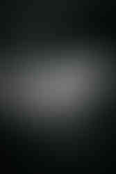 Groom and groomsmen laughing at Woodhall Manor, Woodbridge