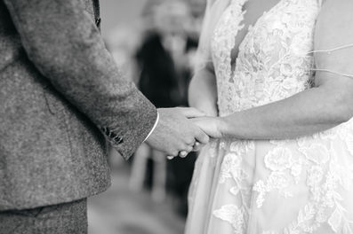 Bride and groom holding hands at Seckford Hall wedding 