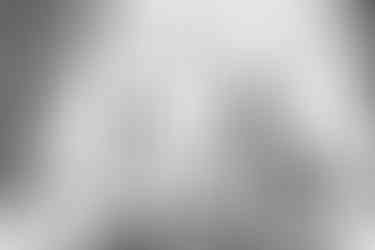 Bride and groom signing register at Seckford Hall wedding