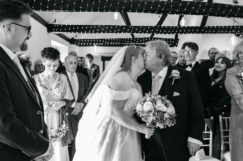 Bride and father of bride sharing a moment at end of aisle at East Mersea Hall wedding