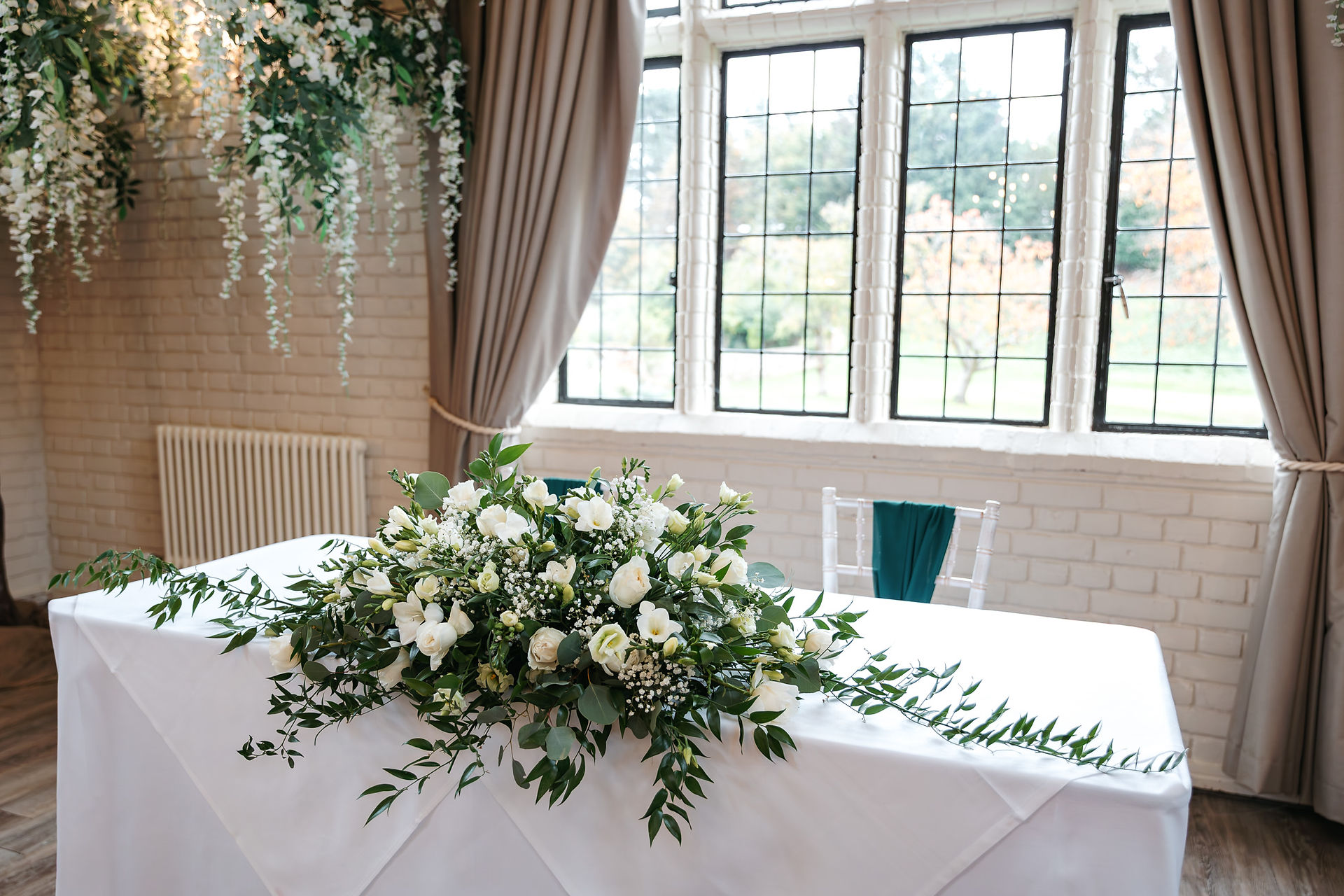 Ceremony table flowers at Seckford Hall wedding 