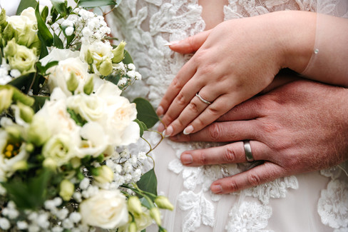 Close up of hands with rings Seckford Hall wedding