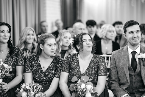 Guests smiling at Seckford Hall wedding