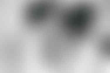 Couple kissing their baby Essex newborn photographer