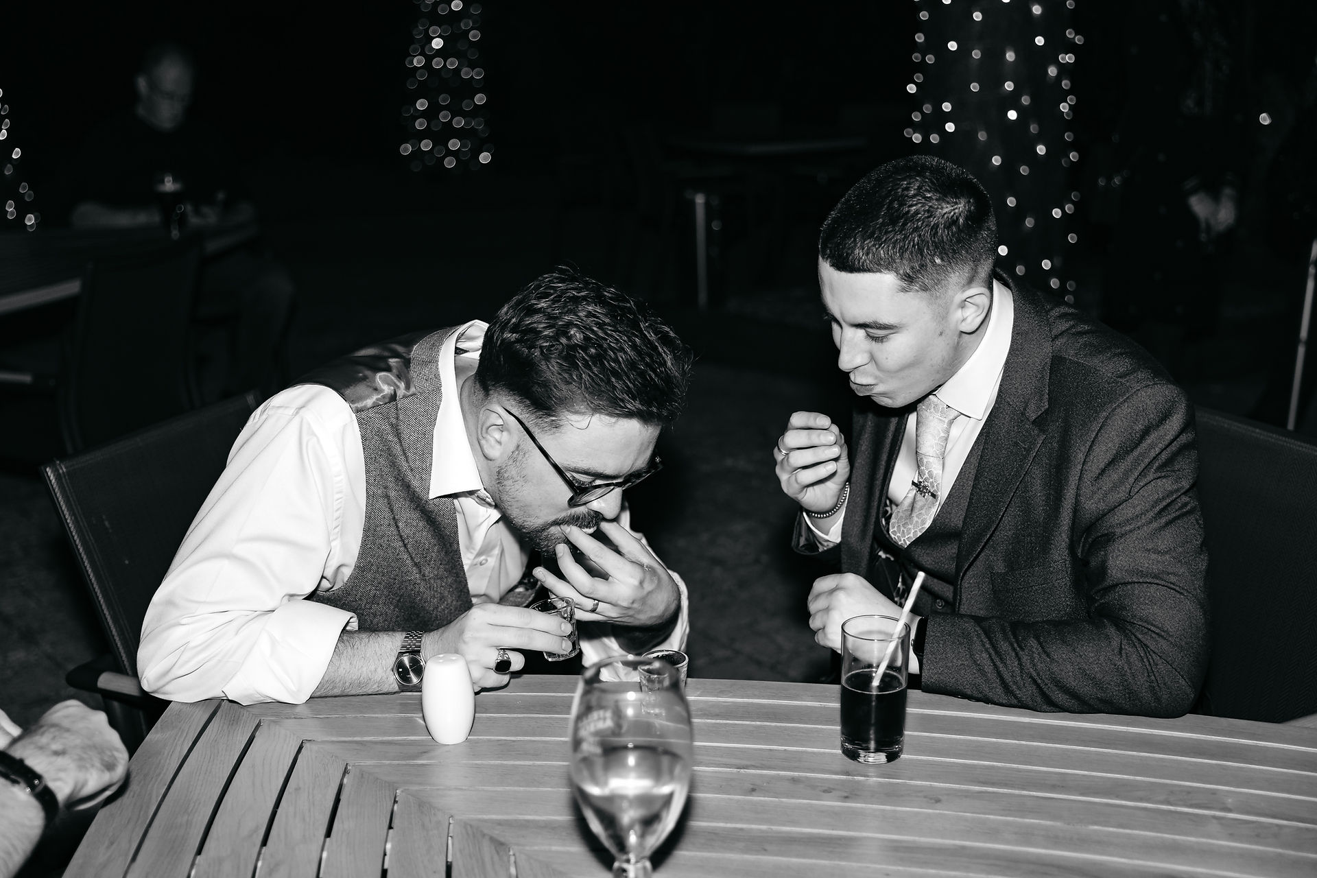 Guests doing shots at East Mersea Hall wedding