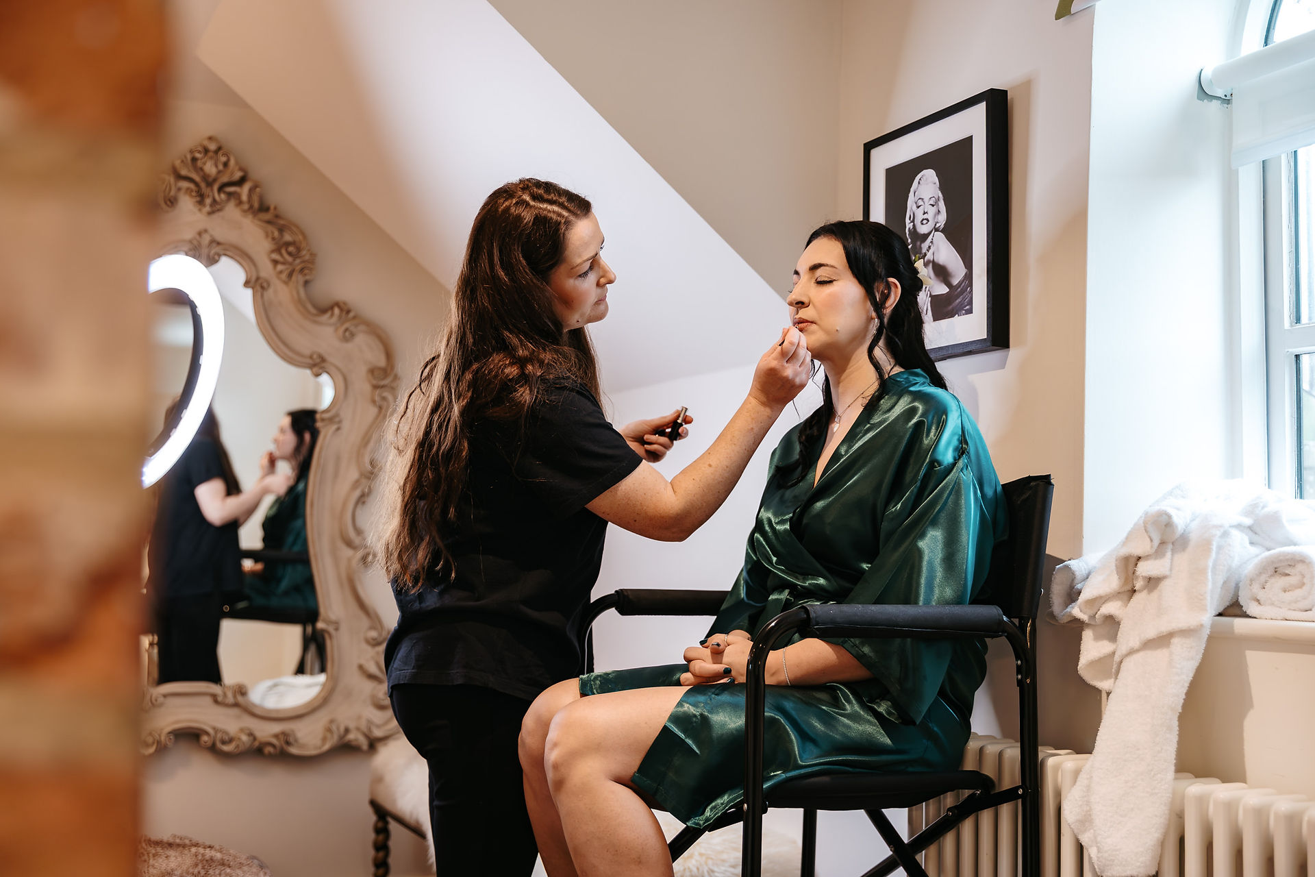 Bridesmaid in makeup chair at Seckford Hall wedding 