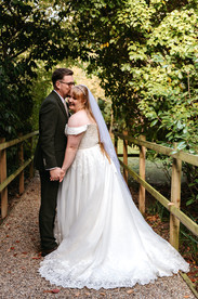 Groom kissing brides head at East Mersea Hall wedding