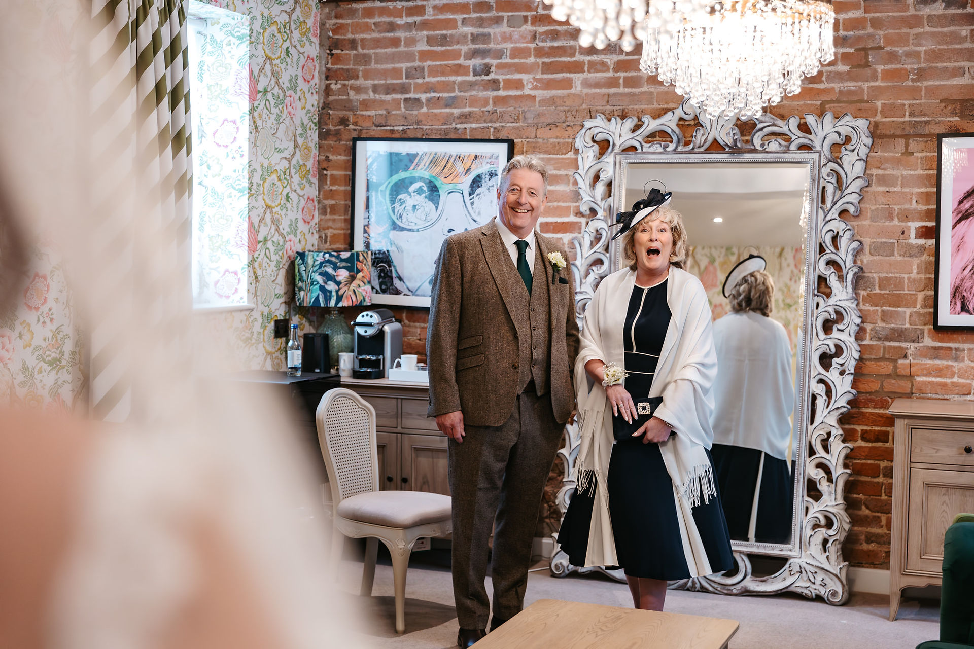 First look with groom's parents at Seckford Hall wedding 