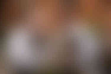 Groom giving father gift at Seckford Hall wedding