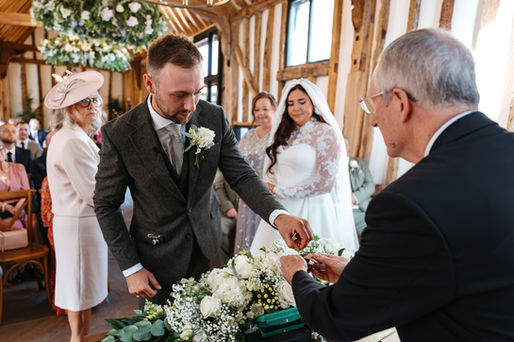 Groom getting ring at High House Wedding, Maldon