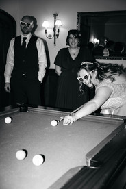 Bridal party playing pool at Woodhall Manor, Woodbridge