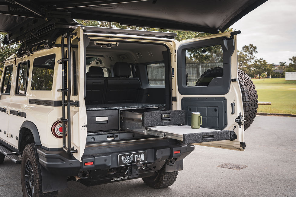 RV Storage Solutions drawer system slid out the back of an INEOS Grenadier under a Bushwakka 270 degree awning