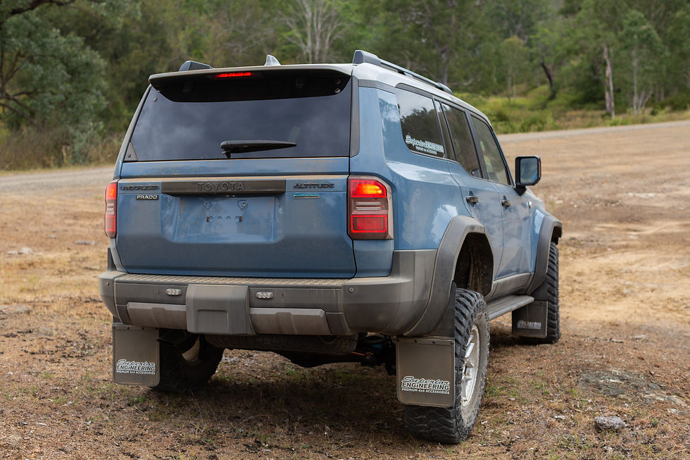 Prado 250 with Superior 4000kg GVM upgrade flexing on uneven terrain showing suspension articulation.