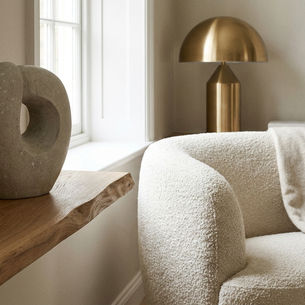 Luxury interior materials and textures: wood, stone, boucle and brass